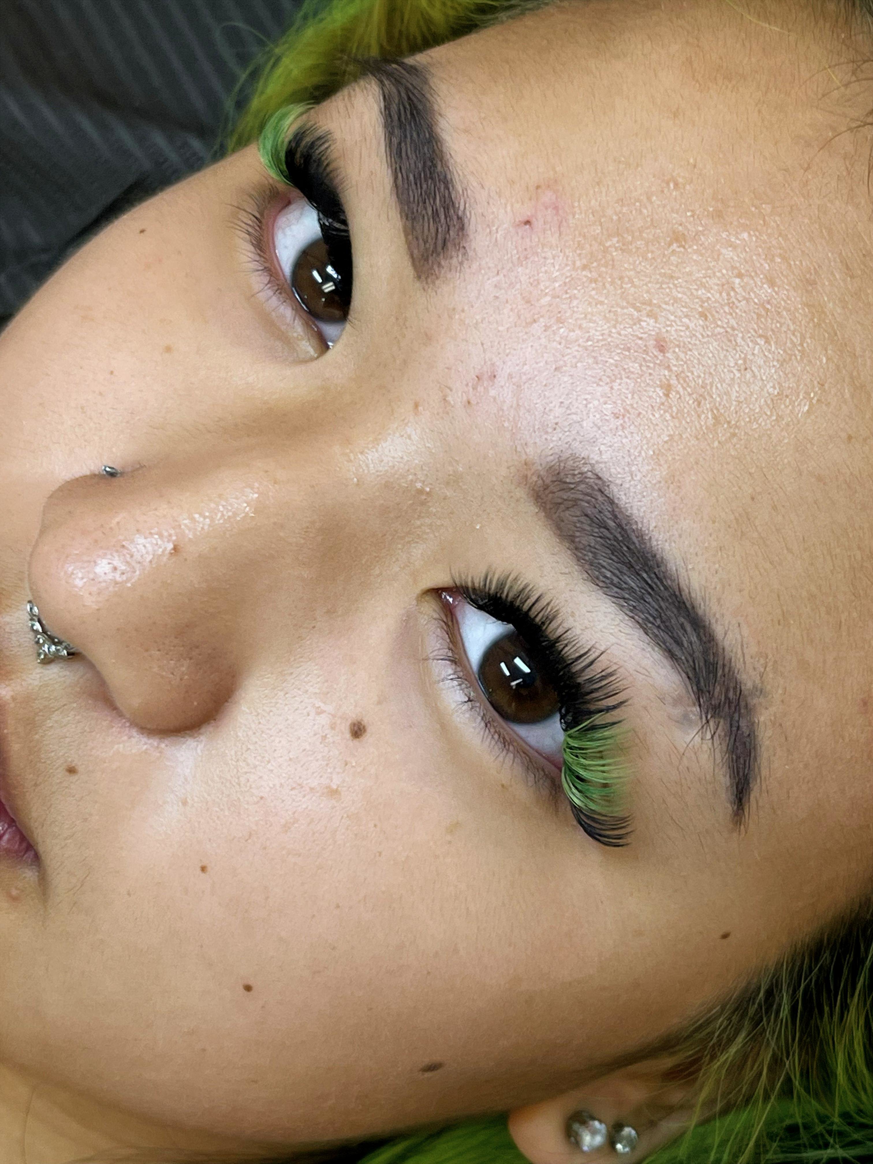 Green color accent lash extension set with bold outer corners